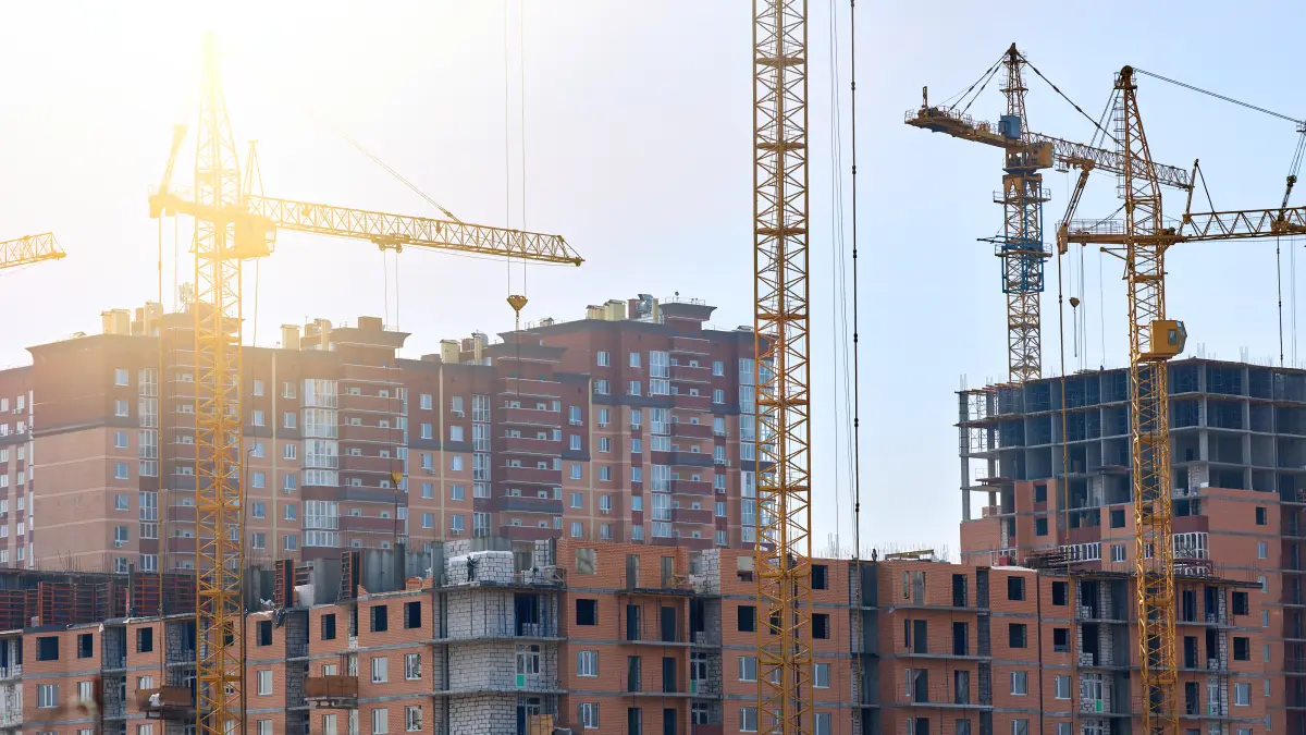 Tower cranes over new commercial construction