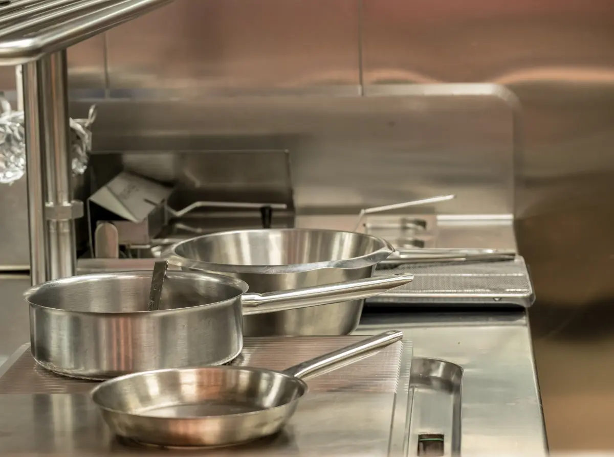 Stainless cookware on the line of a commercial kitchen