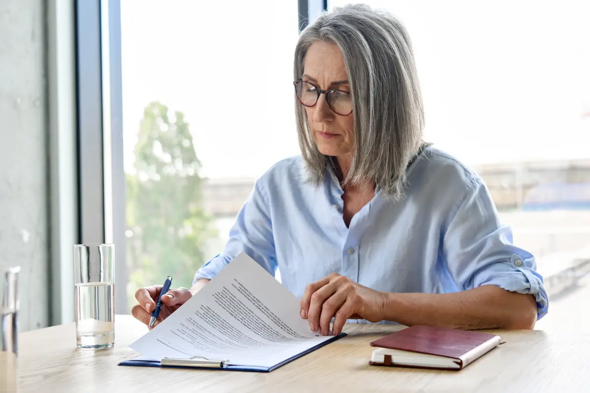 Business owner reviewing lease documents at a desk