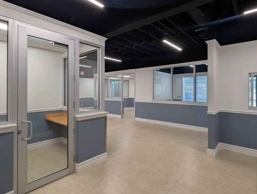 Glass-front private offices built out by our team in Bradenton, Florida