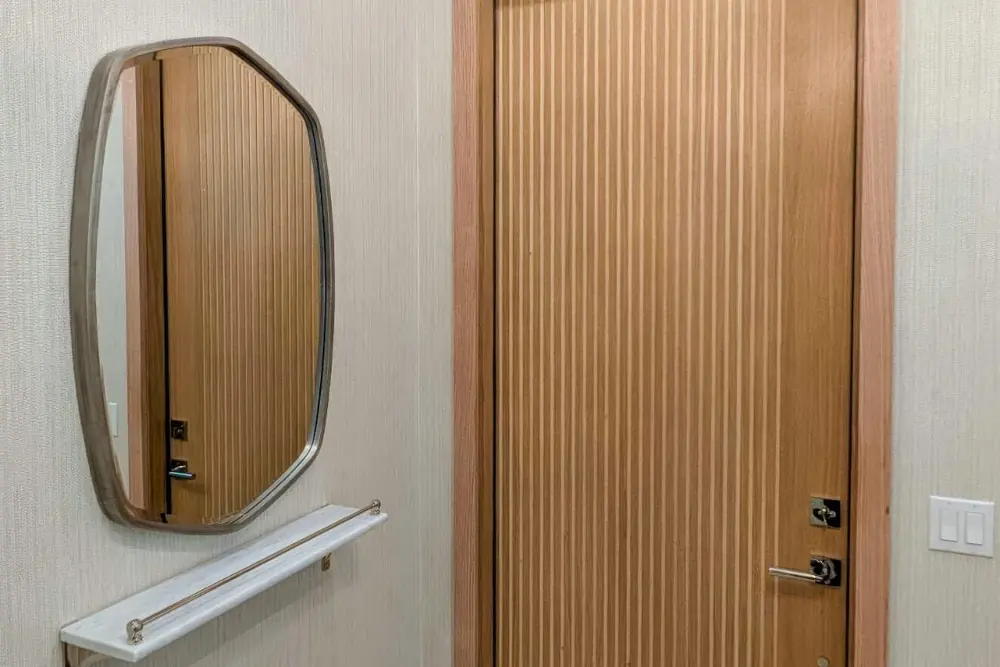 Fluted white-oak door and millwork